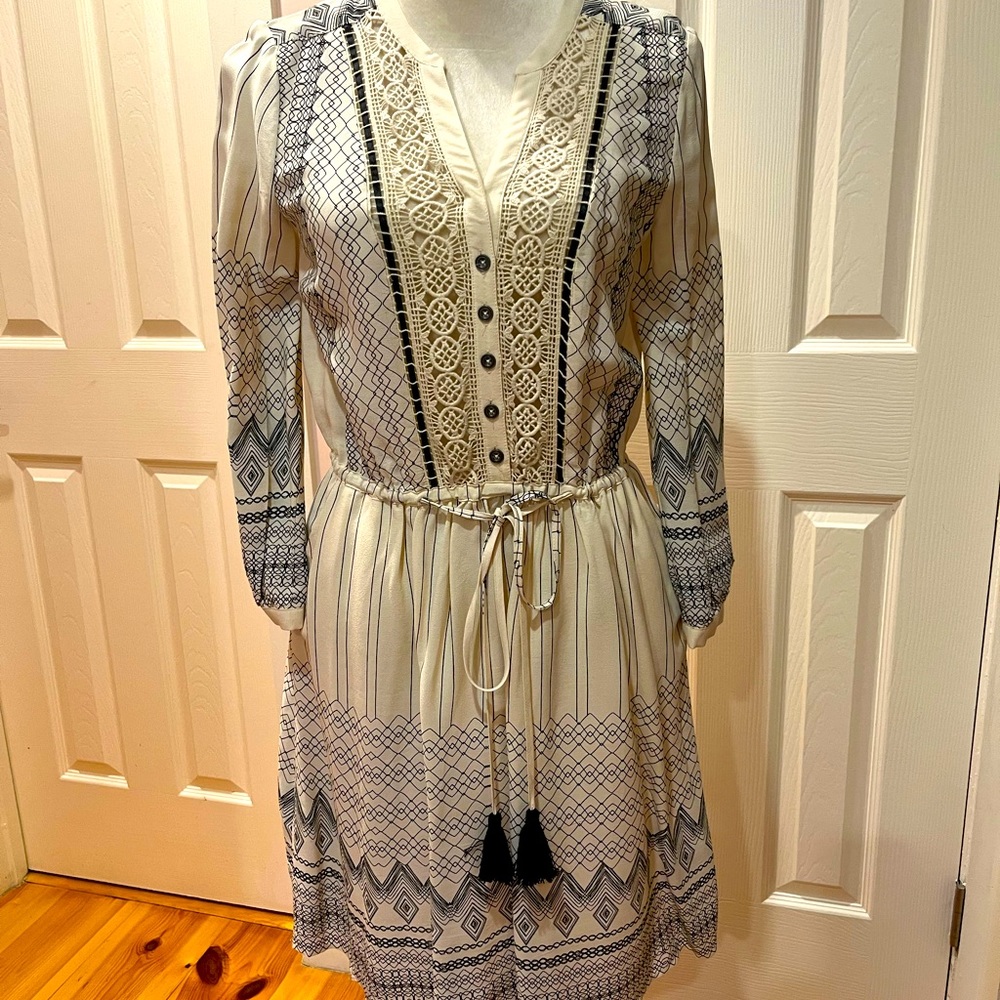 Lightweight, long sleeve dress w/cut outs in front.